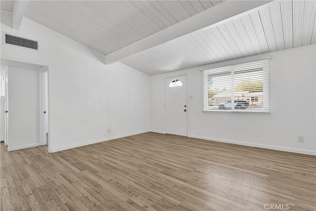 interior space with vaulted ceiling with beams and light hardwood / wood-style flooring