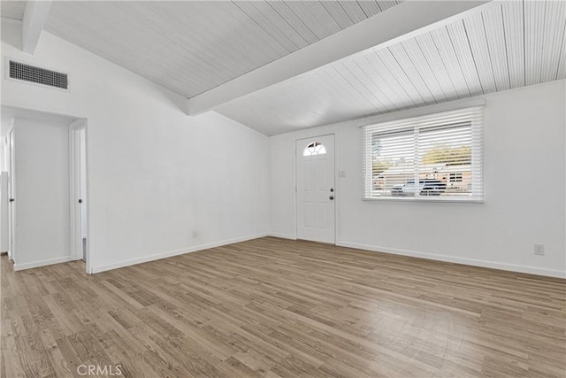 foyer with lofted ceiling with beams, light wood-type flooring, visible vents, and baseboards