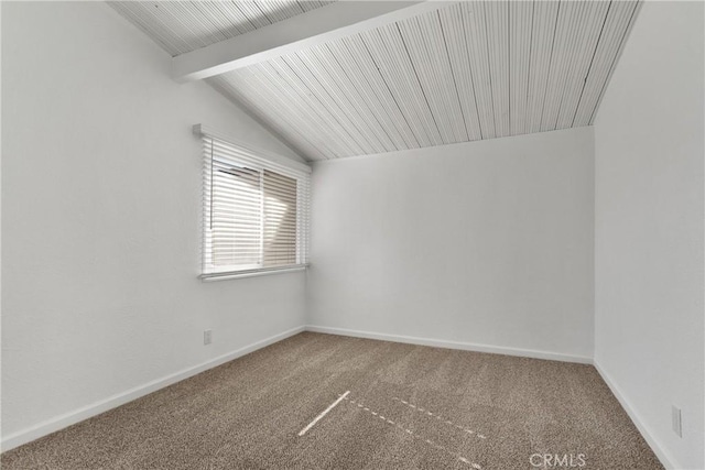 spare room with lofted ceiling with beams and carpet floors