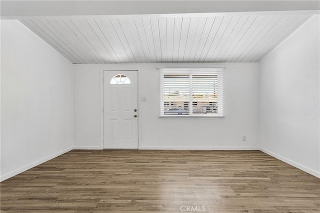 entryway with hardwood / wood-style floors, lofted ceiling, and wooden ceiling