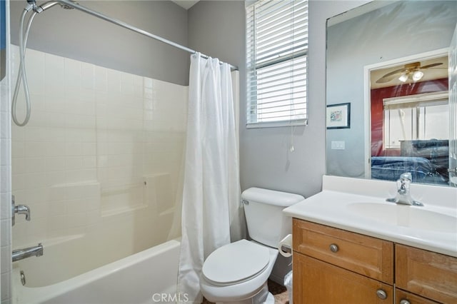 full bathroom featuring ceiling fan, vanity, shower / tub combo, and toilet