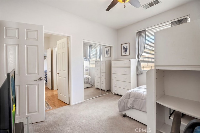 carpeted bedroom featuring ceiling fan