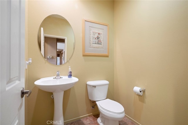 bathroom featuring sink and toilet