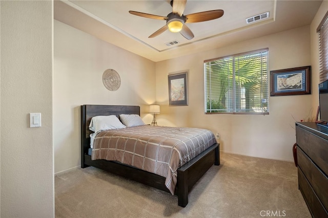 bedroom featuring ceiling fan and light carpet