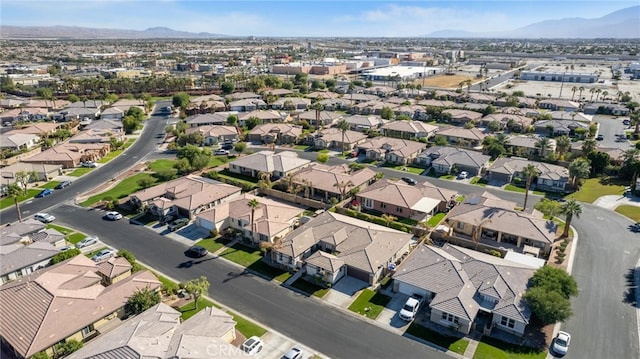 birds eye view of property featuring a mountain view and a residential view