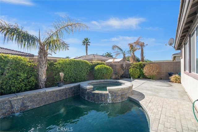 view of swimming pool featuring an in ground hot tub