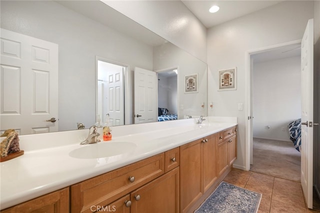 bathroom with tile patterned flooring and vanity