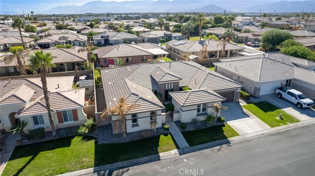 drone / aerial view with a mountain view and a residential view
