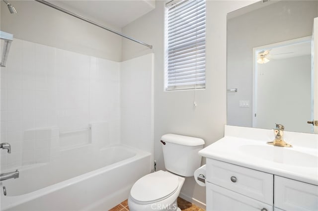 bathroom featuring shower / tub combination, toilet, vanity, and a ceiling fan