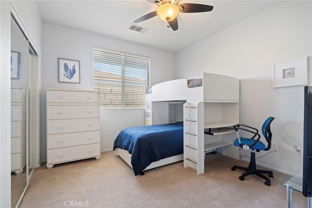 carpeted bedroom with baseboards, visible vents, and ceiling fan