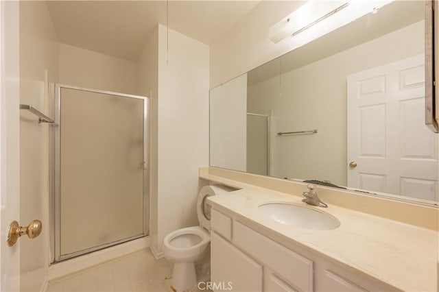 bathroom with a shower with door, vanity, and toilet