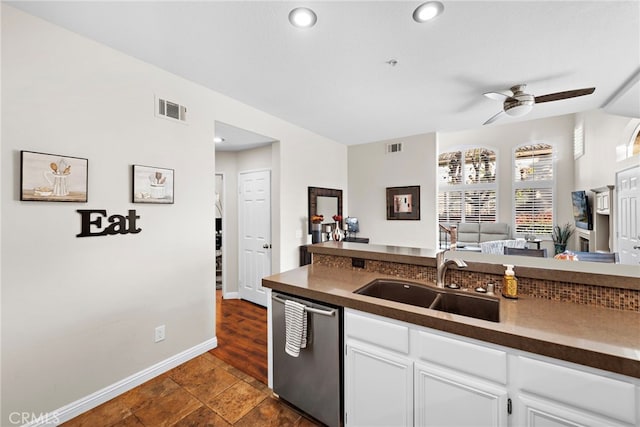 kitchen featuring sink, white cabinets, ceiling fan, and dishwasher