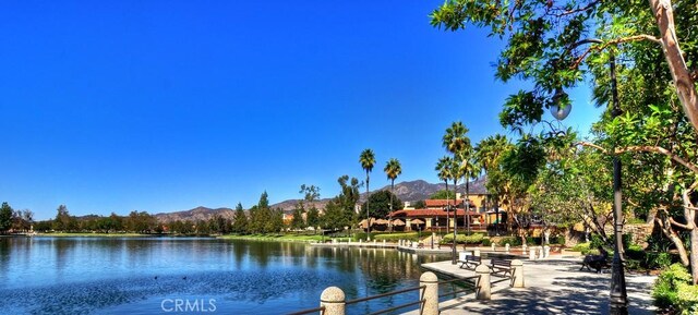 dock area featuring a water and mountain view