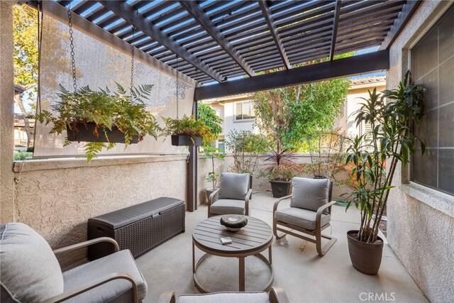 view of patio / terrace featuring a pergola and an outdoor living space