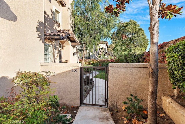 view of gate with fence