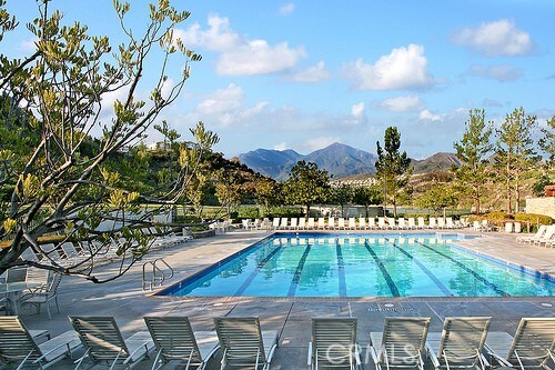 view of pool featuring a patio and a mountain view