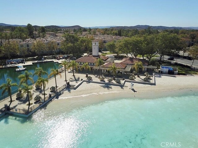 bird's eye view featuring a view of the beach and a water view