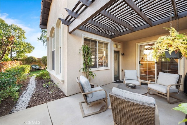 view of patio featuring an outdoor living space and a pergola