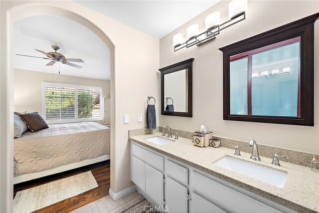 bathroom featuring vanity, ceiling fan, and hardwood / wood-style flooring