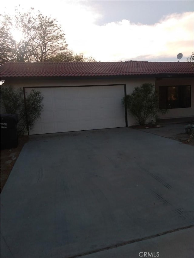 ranch-style home featuring a garage