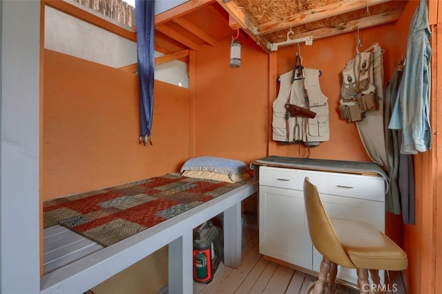 mudroom featuring beam ceiling and wood-type flooring