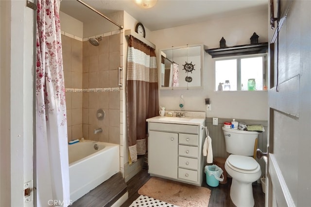 full bathroom featuring vanity, toilet, wood-type flooring, and shower / bath combo with shower curtain