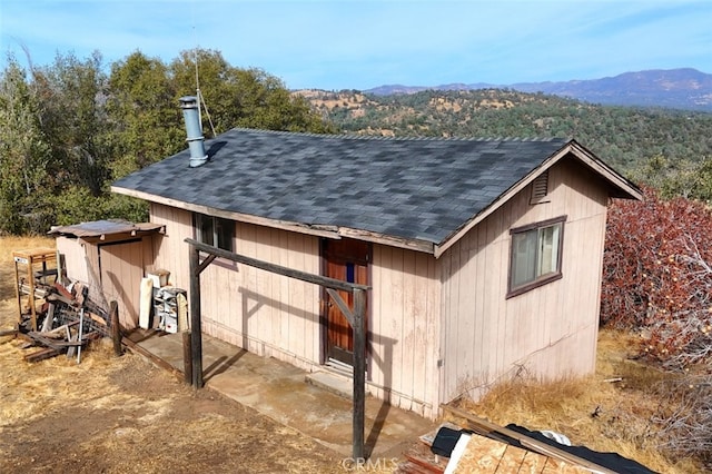 view of outdoor structure featuring a mountain view