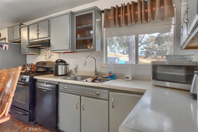 kitchen featuring gray cabinetry, sink, black appliances, and a textured ceiling