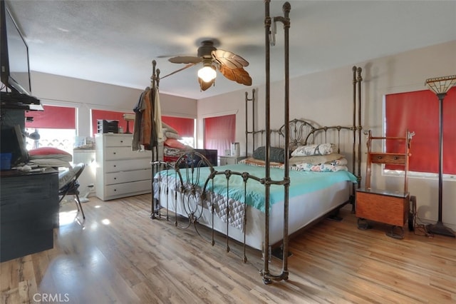 bedroom featuring ceiling fan and light wood-type flooring