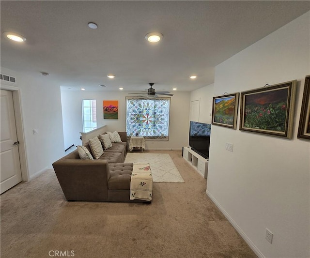 living room featuring ceiling fan and light carpet