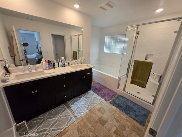 bathroom with separate shower and tub and vanity