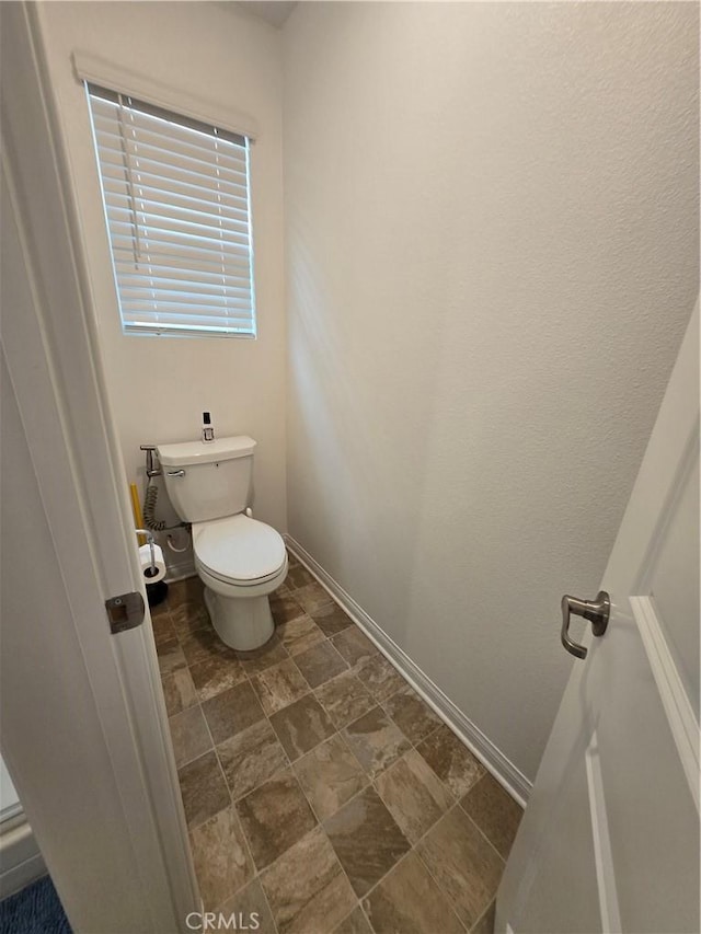 bathroom featuring toilet