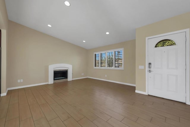 unfurnished living room featuring wood-type flooring