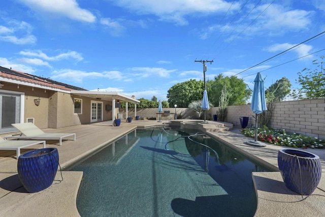 view of swimming pool with a patio area and french doors