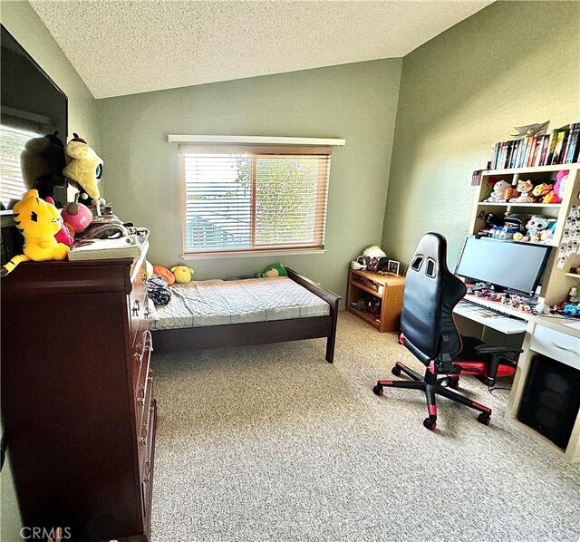 carpeted bedroom featuring lofted ceiling and a textured ceiling