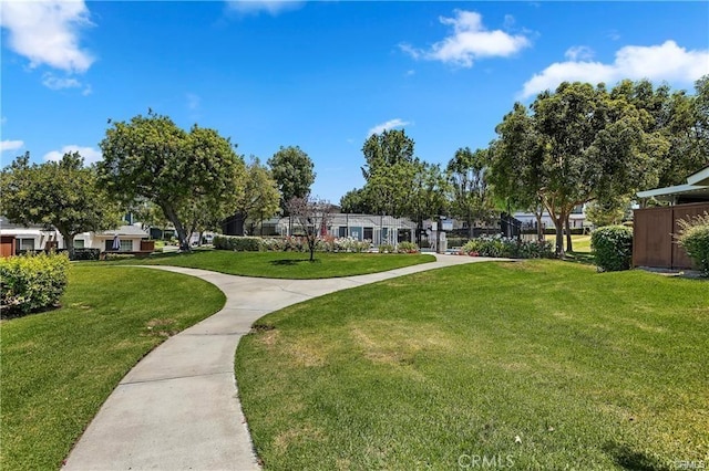 view of home's community featuring a yard