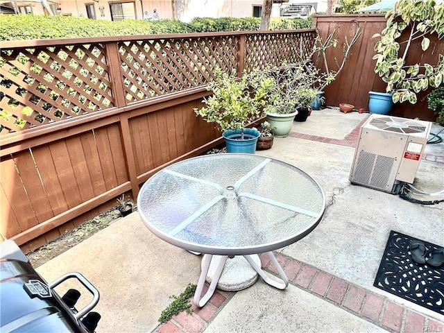 view of patio with central AC unit