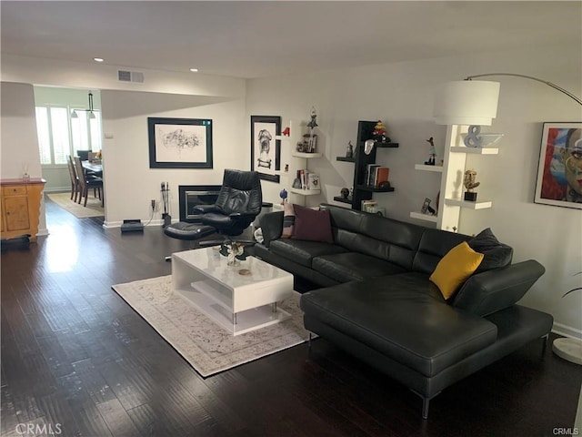 living room with dark hardwood / wood-style floors