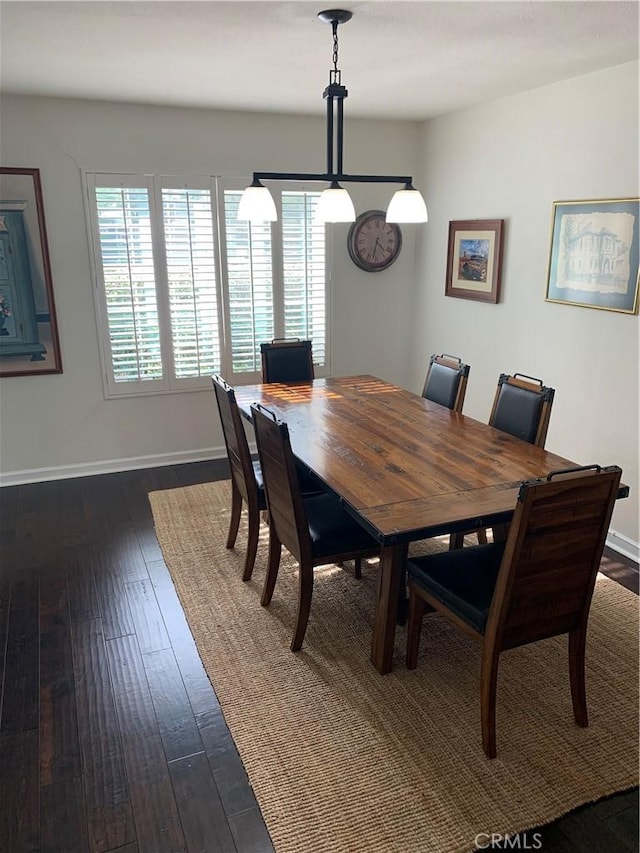 dining space featuring dark hardwood / wood-style floors