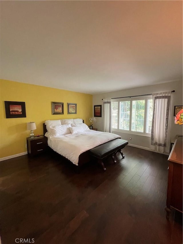 bedroom featuring dark hardwood / wood-style floors