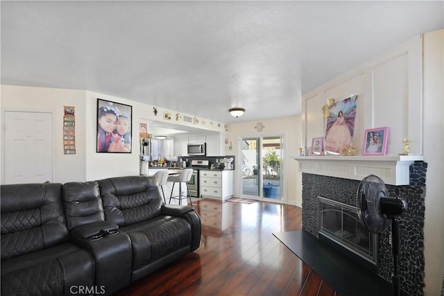 living room featuring dark hardwood / wood-style flooring