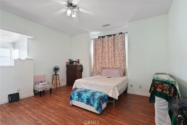 bedroom featuring wood-type flooring and ceiling fan