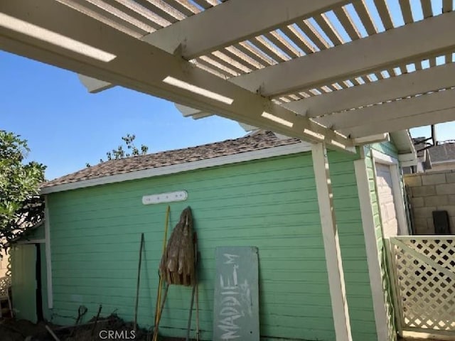 view of outbuilding with a pergola