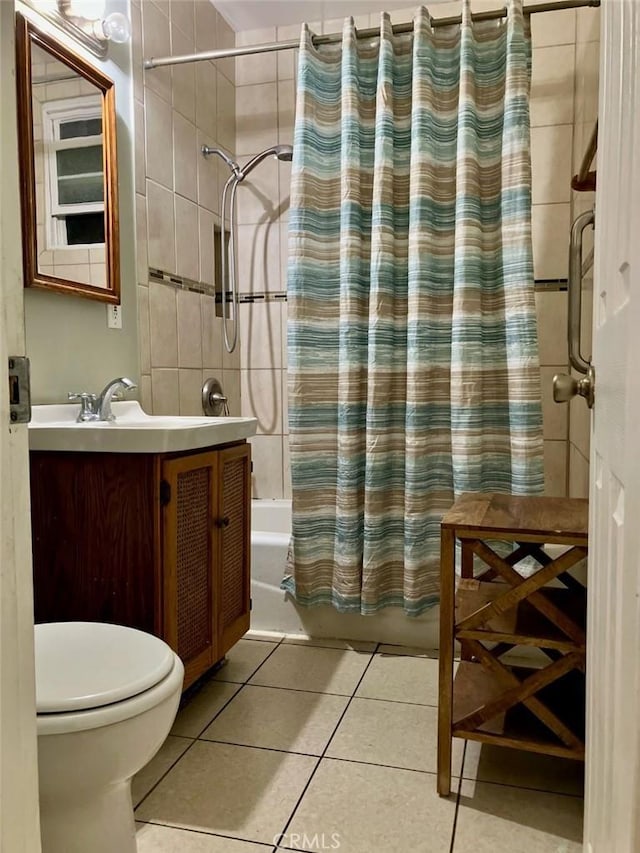 full bath with vanity, tile patterned floors, shower / tub combo, and toilet