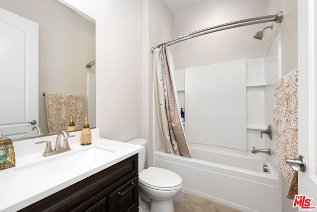 full bathroom with shower / tub combo, vanity, toilet, and tile patterned floors