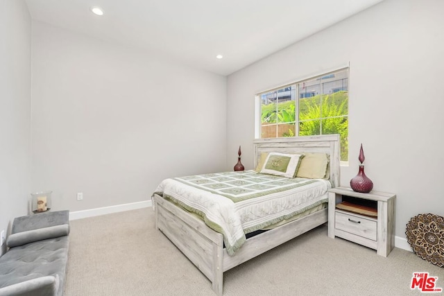 bedroom featuring light colored carpet