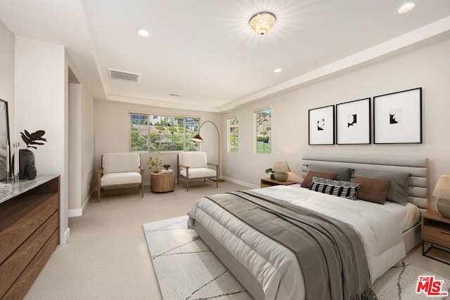 bedroom with light colored carpet