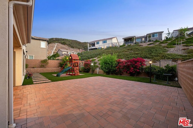 view of patio with a playground