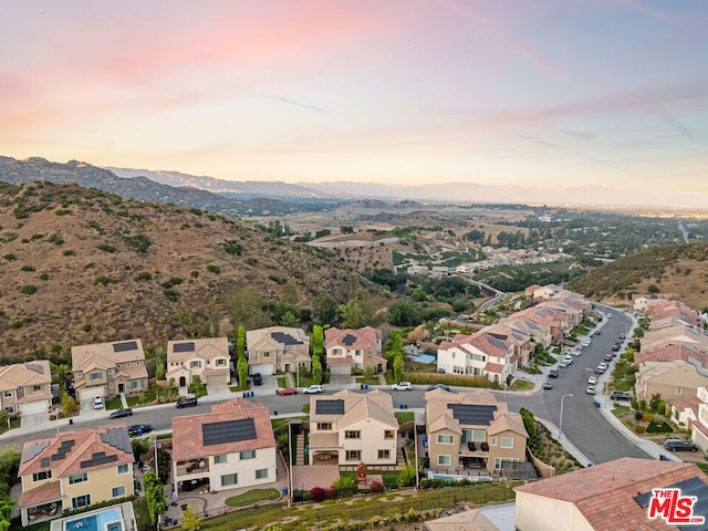 aerial view at dusk with a mountain view