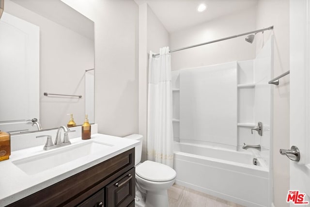 full bathroom featuring vanity, shower / tub combo, and toilet